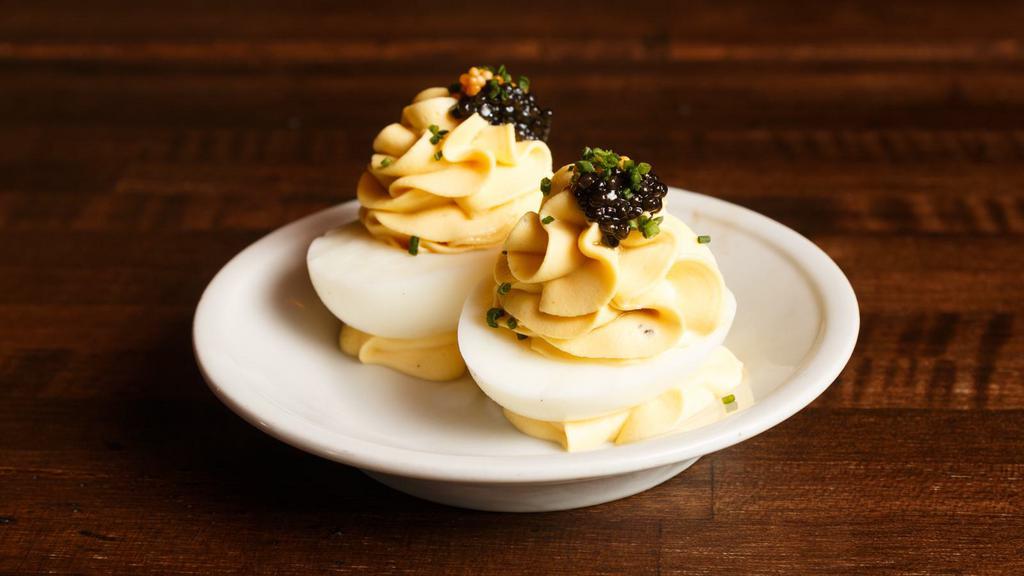 Deviled Eggs (4 Pcs) · Gluten-free. American sturgeon caviar, pickled mustard seeds, chives.
