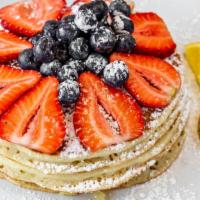 Fresh Fruit Pancakes (Seasonal) · Topped with fresh strawberries and blueberries.