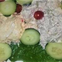 House Garden Salad · Mix green, portabella mushrooms, red peppers, fresh mozzarella and artichoke hearts.