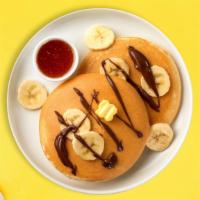 Classic Banana & Nutella Pancakes · Fluffy banana nutella pancakes cooked with care and love served with butter and maple syrup....