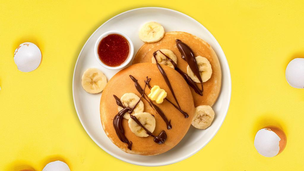 Classic Banana & Nutella Pancakes · Fluffy banana nutella pancakes cooked with care and love served with butter and maple syrup. Served in pairs.