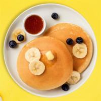Head Over Peels Banana Berry Pancakes · Fluffy banana and berries pancakes cooked with care and love served with butter and maple sy...