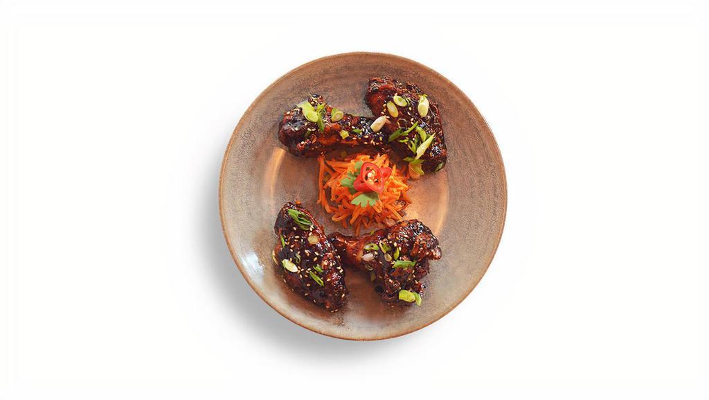 Korean Chicken Wings · fried chicken wings . sweet + spicy sauce.
pickled carrot garnish. scallions. sesame seeds