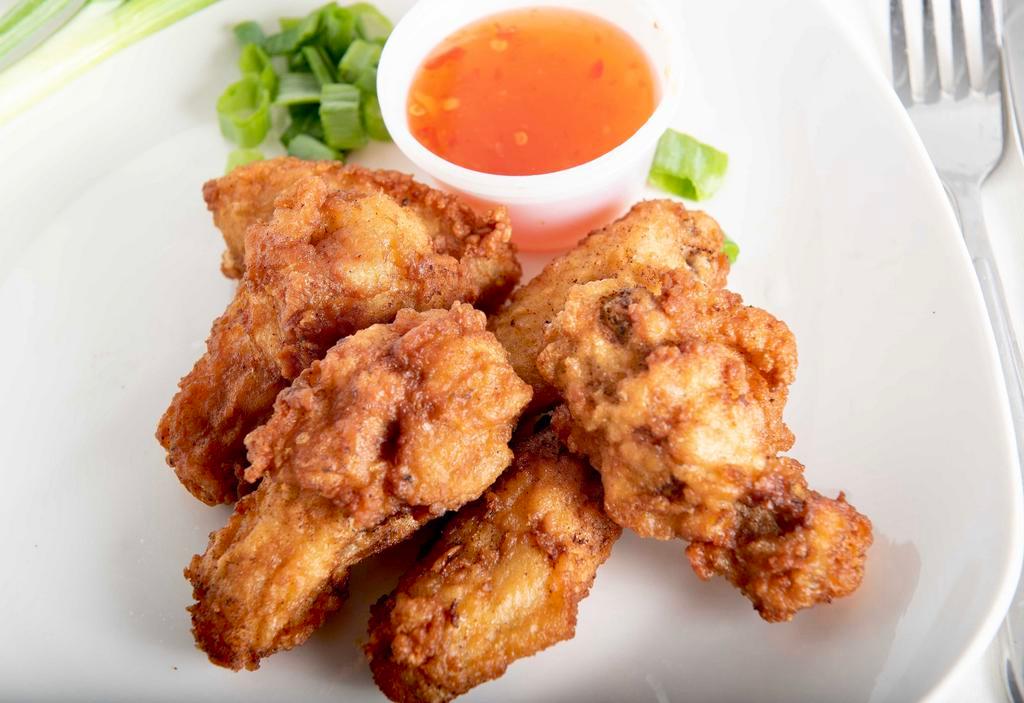 Thai Chicken Wings (6) · Our very own marinated chicken wing served with sweet chili sauce.