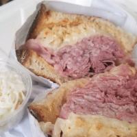 The Reuben · Corned beef, pastrami, or turkey topped with sauerkraut and melted swiss cheese on toasted r...