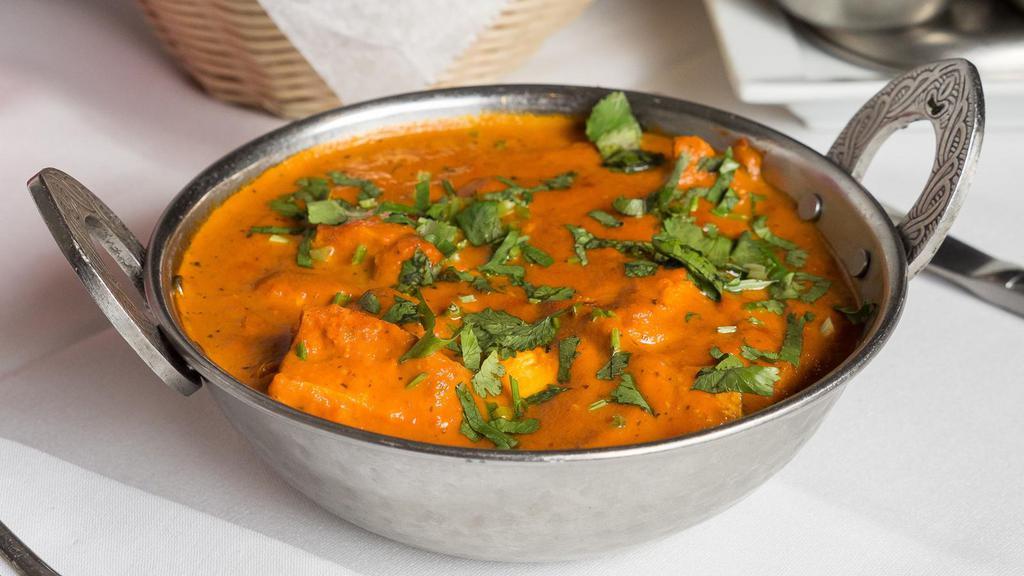 Chicken Tikka Masala · Chicken cubes cooked in cream based onion and tomato sauce.