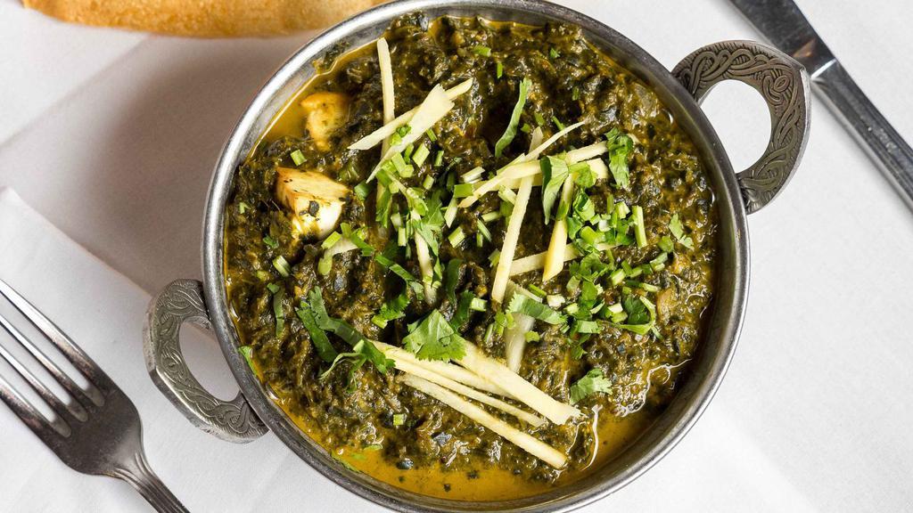 Saag Paneer · Home-made cheese cubes cooked with spinach in creamy onion and tomato sauce.