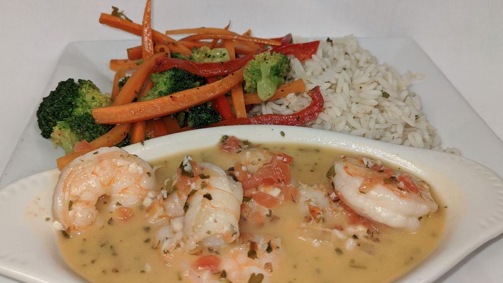 Shrimp Scampi · Sauteed shrimp in a butter garlic sauce, served with rice and fresh veggies