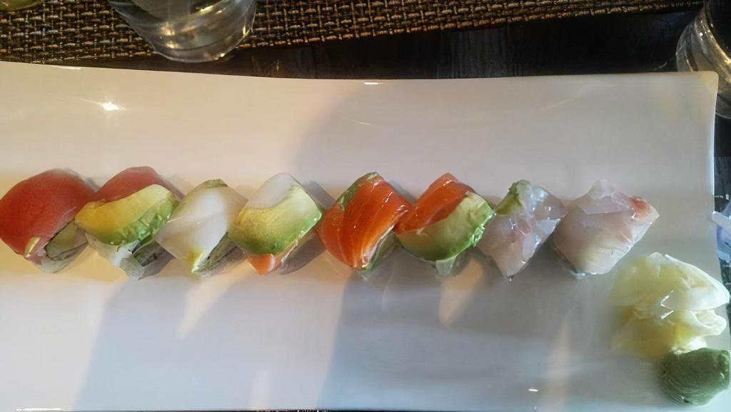 Rainbow Roll · Eight pieces. Tuna, salmon, yellowtail, shrimp, mackerel over california roll.