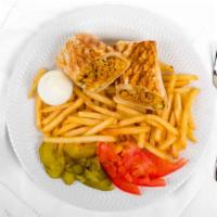 Shawarma Arabi Entrée · Chicken or beef shawarma sandwich topped with fries and vegetables.