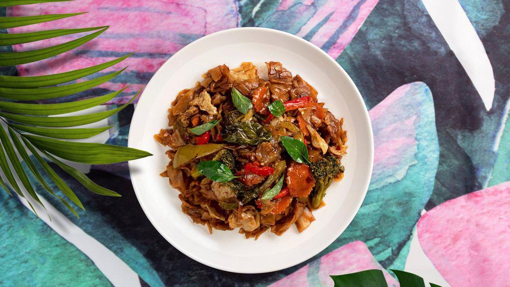 Basil Noodles · Flat rice noodles served with onions and basil and your choice of tofu or vegetables.