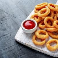 Crispy Onion Rings · Our thick-cut onion rings are made from whole white onions, battered with a subtle blend of ...