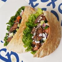 Beef & Lamb Gyro Pita · Mixed beef & lamb gyro with tomatoes, cucumber, onions, and your choice of sauce wrapped in ...