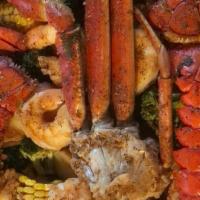 Big Papi · 2 Lobster Tails, 1/2 Snow Crabs, 1lb Shrimp includes broccoli, corn, and red potatoes.