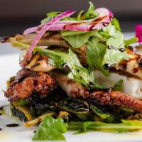 Grilled Octopus · Grilled Octopus served with Chopped Broccoli Rabe, Spicy Cherry Peppers, Capers and Olives.