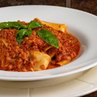 Pappardelle Bolognese · Homemade Pappardelle Noodles sauteed in a Homemade Meat Sauce.