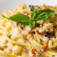 Bucatini Carbonara · Homemade Bucatini sauteed with chopped Sweet Onion, Pancetta and Egg Yolk with a Touch of Cr...