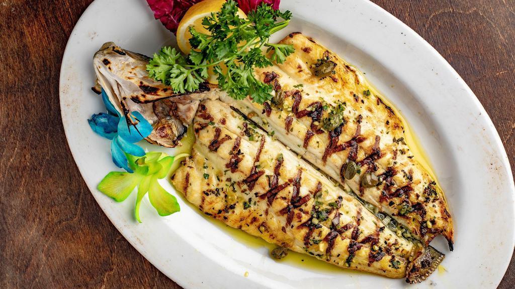 Branzino · Whole Mediterranean Sea bass, baked or grilled, served with a fresh herbs sauce, garlic, and extra virgin olive oil
