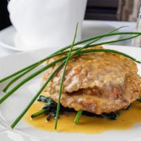 Veal Saltimbocca · Thinly sliced veal scaloppini wrapped in prosciutto and sage, sautéed in a light white wine ...