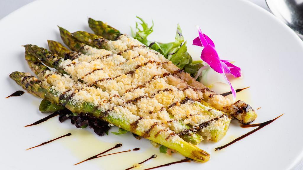 Roasted Asparagus · Asparagus roasted with Cherry Wine and Olive Oil, topped with Parmesan Cheese and served over Mixed Greens.