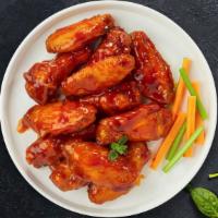 Buff Flying Chicken · Wings cooked and tossed in our buffalo wing sauce. Served with Blue Cheese.