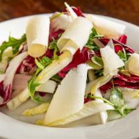 Tricolore · Radicchio, endive and arugula salad with shaved parmigiano.