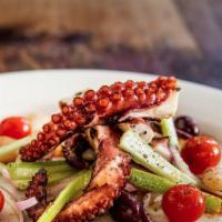 Polpo Alla Griglia · Octopus with gigante beans, celery, olives, and tomatoes.