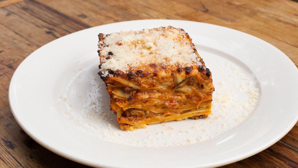 Lasagne Alla Bolognese · House made Lasagna bolognese with bechamel and parmigiano.