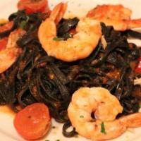 Linguine Al Nero Di Seppia With Seafood  · Homemade Squid ink Linguine with mussels, clams , calamari and shrimp in tomato sauce