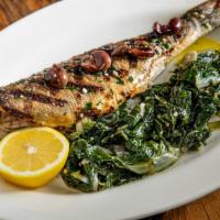 Spigola · Oven roasted whole Mediterranean Sea bass with olives, lemon and Zucchini