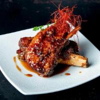 Sticky Ribs · Twice cooked Pork Ribs, Cilantro, served with Hoisin Sweet Chili Sauce.