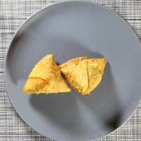 Vegetable Samosa · 2 Pc. Crisp triangular.