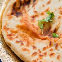Garlic Naan · Soft white flour bread with garlic baked in the tandoor.