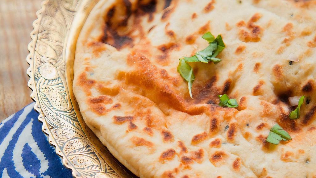 Garlic Naan · Soft white flour bread filled with sauteed garlic.