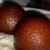 Gulab Jamon · Indian deserts consisting of fried balls made of dough from milk solids and soaked in aromat...