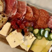 Salumi & Cheese Board · Selection of three cured meats, cheeses, pickled vegetables, grilled bread.
