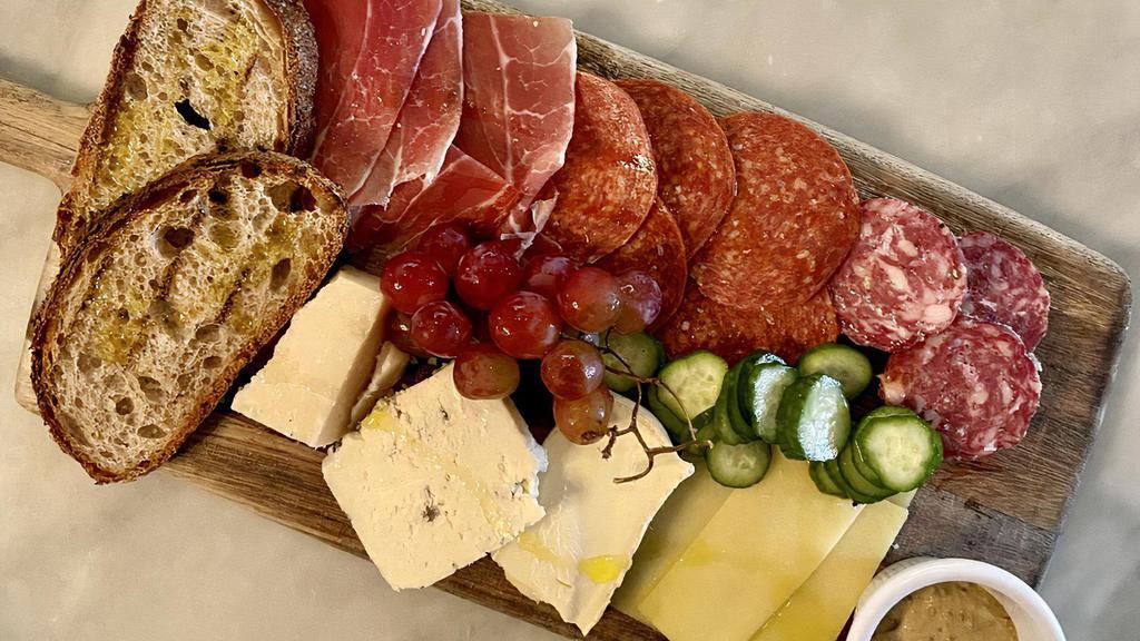Salumi & Cheese Board · Selection of three cured meats, cheeses, pickled vegetables, grilled bread.