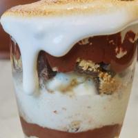 Gatsby'S S'Mores Sundae · Vanilla ice cream, chocolate pieces, graham cracker crumbs, chocolate syrup and toasted mars...