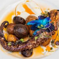 Grilled Pulpo · Charred octopus, herb roasted potatoes, roasted cauliflower purée, paprika oil.