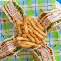 Club House Con Pollo Sandwich · Ham, cheese,bacon , lettuce, tomato, mayonnaise, chicken, French fries , a drink.