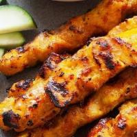 Satay · Four pieces. Sliced chicken or beef marinated in coconut milk and Thai herbs, then charbroil...