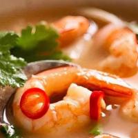 Tom Yum Koong Soup · Hot and spicy shrimp soup. Shrimp simmered with mushrooms, lime juice, bell pepper, lemongra...