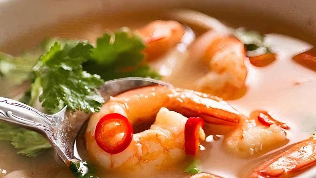 Tom Yum Koong Soup · Hot and spicy shrimp soup. Shrimp simmered with mushrooms, lime juice, bell pepper, lemongrass, Thai herbs and shrimp paste.