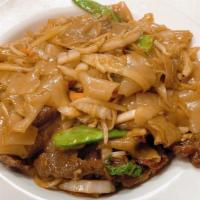 Beef Chow Fun · With rice noodles.