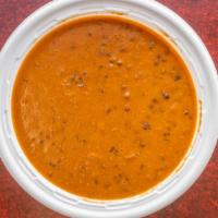 Dal Makhani · Black lentils cooked with garlic, onion and ginger with butter.