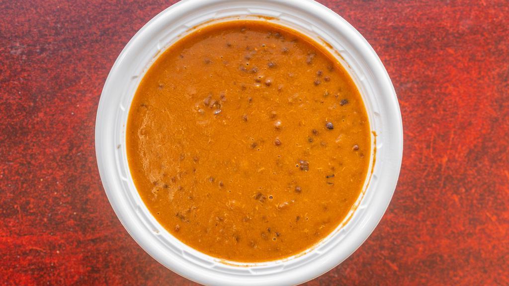 Dal Makhani · Black lentils cooked with garlic, onion and ginger with butter.
