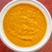 Yellow Dal · Yellow lentils cooked with onion, garlic.