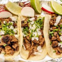 Tacos (3) · Todos los pedidos se sirven con cebollas, cilantro, limas y rábanos. / All orders served wit...