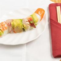 Rainbow Roll · Crab, avocado, cucumber inside top with white tuna, salmon, red snapper tuna and avocado on ...