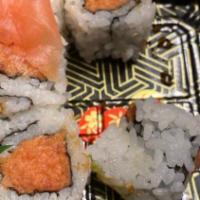 Jd 1. Sushi Deluxe · Nine pieces sushi and one piece California roll.